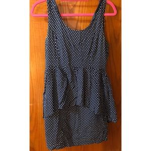 Blue and white polka dot dress with peplum accent